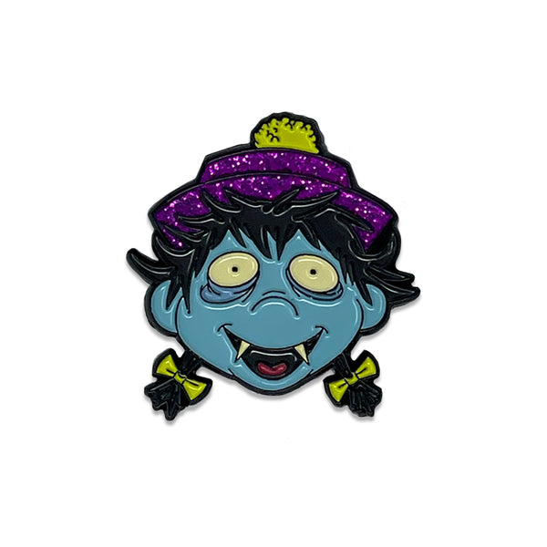 Cartoon-style Osaka Popstar enamel pin of a blue monster with glitter hat details