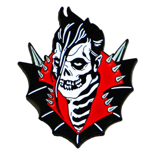 Stylized skull emblem enamel pin with zebra-striped hair and spiked collar on red background