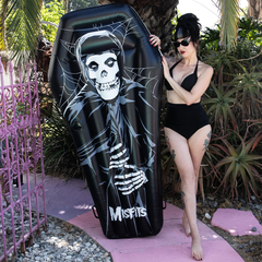 Black Misfits Pool Float coffin shape with skeleton design and logo for fun summer vibes