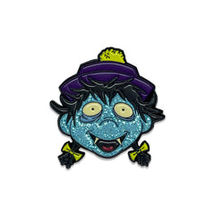 Cartoon enamel pin featuring Osaka Popstar’s blue-faced character with glitter face