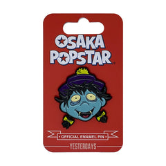 Enamel pin of Osaka Popstar Hopping Ghost cartoon zombie with blue skin and yellow eyes