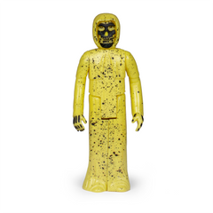 Yellow Misfits Fiend Reaction Figure with skull-like face and speckled surface