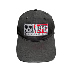 Black baseball cap featuring Misfits Records logo embroidered on the front