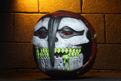 Painted motorcycle helmet skull with green teeth, featured in Madballs Misfits Fiend