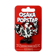 Enamel pin of a horned cartoon character on red card, part of Kawaii Black Metal set